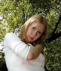 Prankish babe pisses onto a table in the park