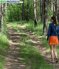 Young babe goes for a wee on an empty forest path