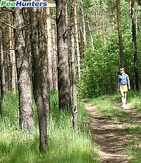 Juicy chick with a perfect body peeing outdoors