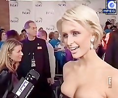 Paris Hilton shows off her low decolette