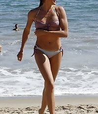 Female in white bikini relaxing in the water