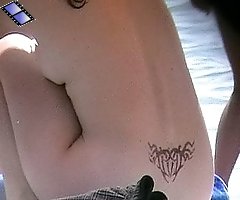Juicy tattooed girl caught on cam on a nude beach