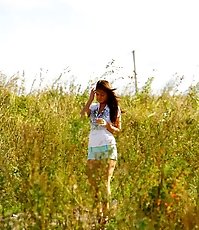Stunningly beautiful leggy doll weeing outdoors